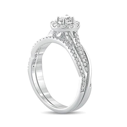 0.5 CT. TW Oval Diamond Frame Twist Shank Bridal Set in 10K White Gold