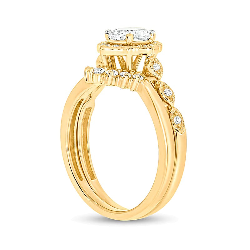 0.75 CT. TW Oval Diamond Frame Vintage-Style Bridal Set in 14K Gold (I/I2)
