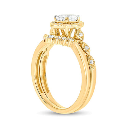 0.75 CT. TW Oval Diamond Frame Vintage-Style Bridal Set in 14K Gold (I/I2)