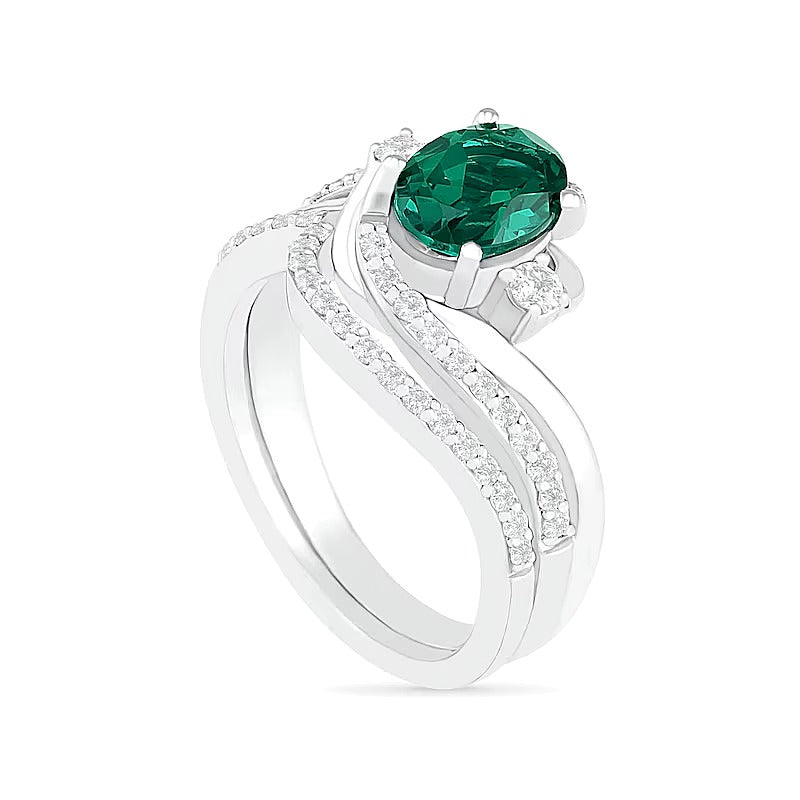 Oval Lab-Created Emerald and White Sapphire Side Accent Double Bypass Split Shank Bridal Set in Sterling Silver