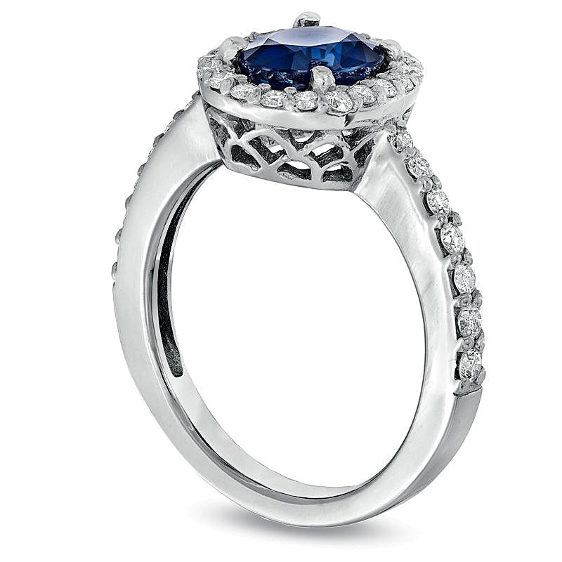 Oval Blue Sapphire and 0.5 CT. TW Diamond Frame Engagement Ring in 14K White Gold