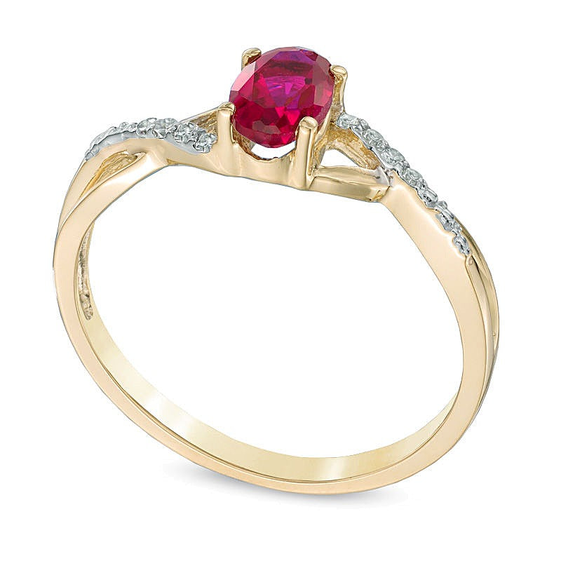 Oval Lab-Created Ruby and Diamond Accent Twist Engagement Ring in 10K Gold