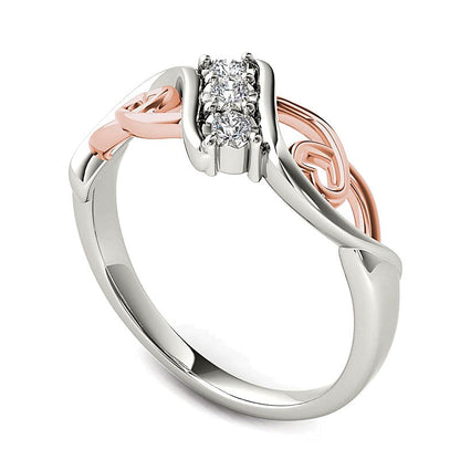 0.1 CT. TW Diamond Three Stone Bypass with Hearts Ring in 14K White Gold and Rose Rhodium