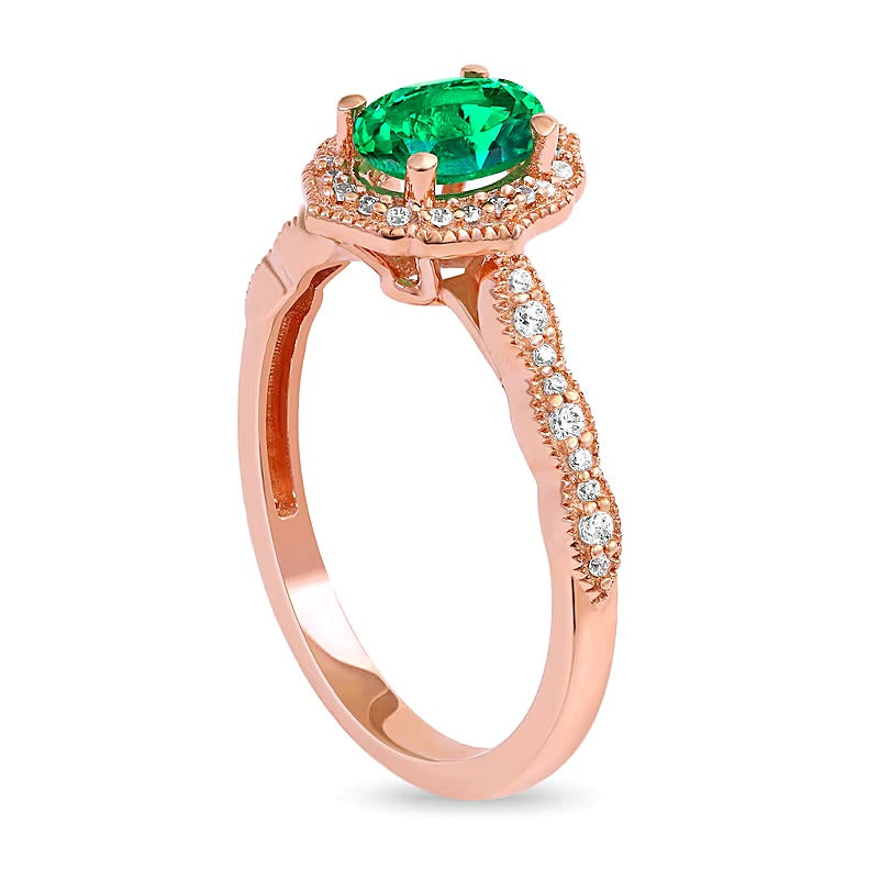 Oval Emerald and 0.17 CT. TW Diamond Quatrefoil Frame Vintage-Style Ring in 10K Rose Gold