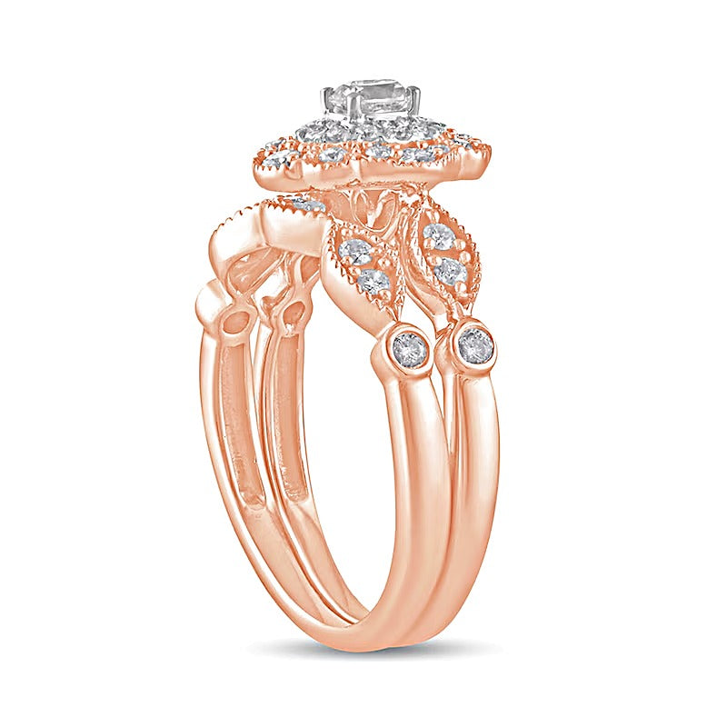 0.63 CT. TW Oval Diamond Double Petal Frame Vintage-Style Bridal Set in 10K Rose Gold