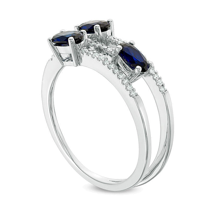 Oval Blue Sapphire and 0.1 CT. TW Diamond Three Stone Wrap Ring in 10K White Gold