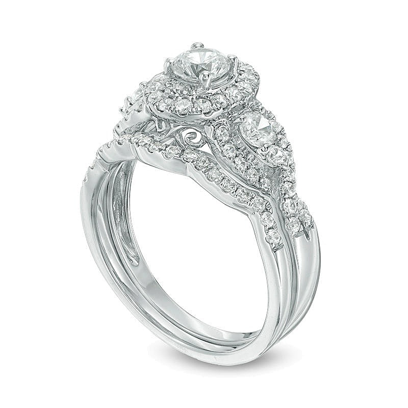1.17 CT. TW Diamond Three Stone Oval Frame Twist Bridal Set in 14K White Gold