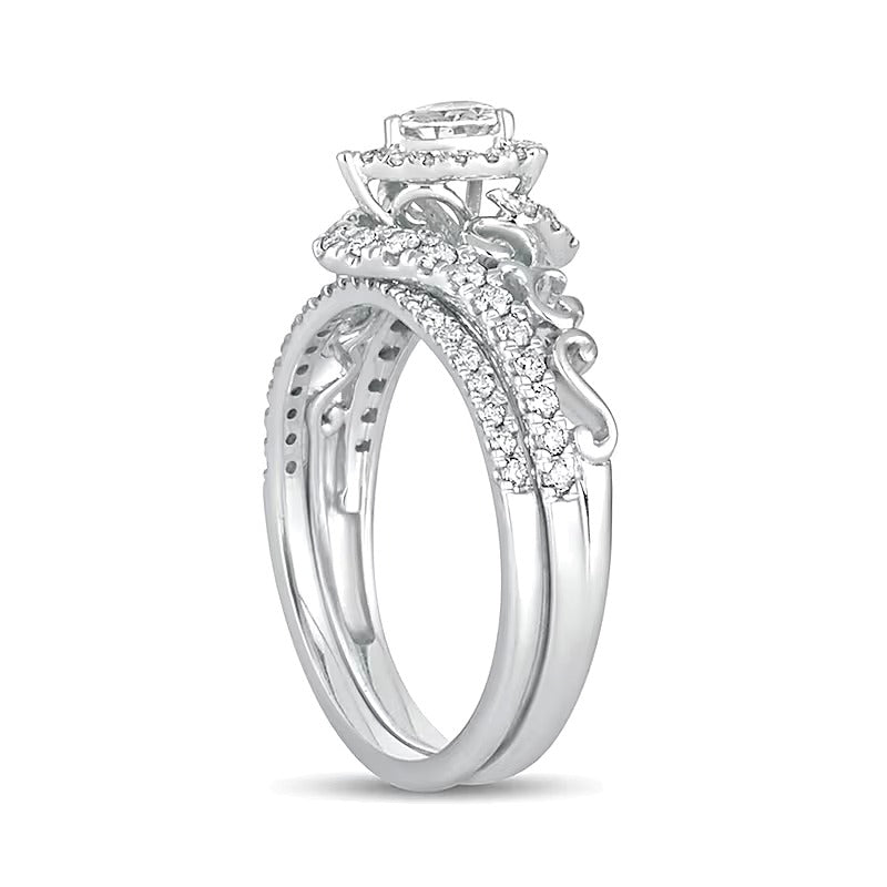 0.63 CT. TW Pear-Shaped Diamond Frame Filigree Bypass Bridal Set in 10K White Gold