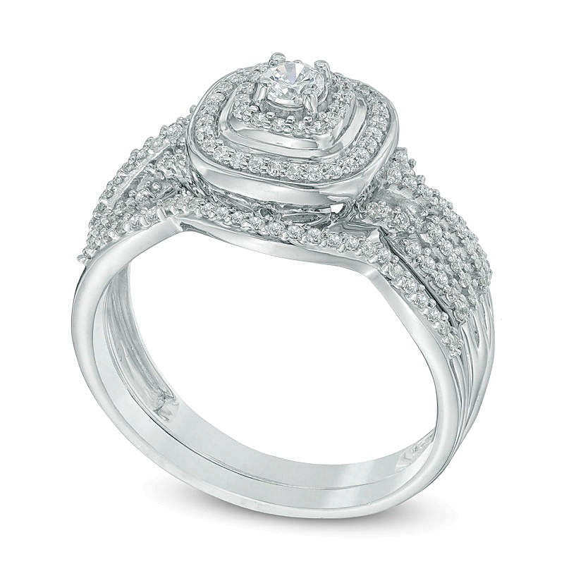 0.5 CT. TW Diamond Cushion Frame Twist Shank Bridal Set in 10K White Gold