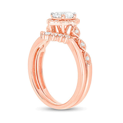 0.75 CT. TW Oval Diamond Frame Vintage-Style Bridal Set in 14K Rose Gold (I/I2)