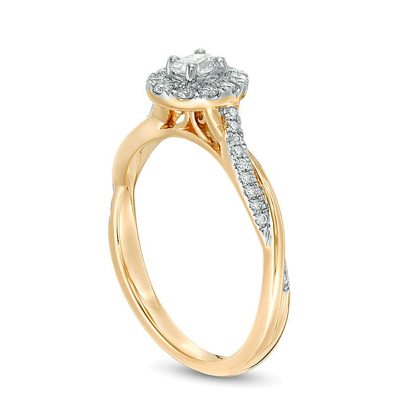 0.38 CT. TW Oval Diamond Frame Twist Engagement Ring in 10K Gold