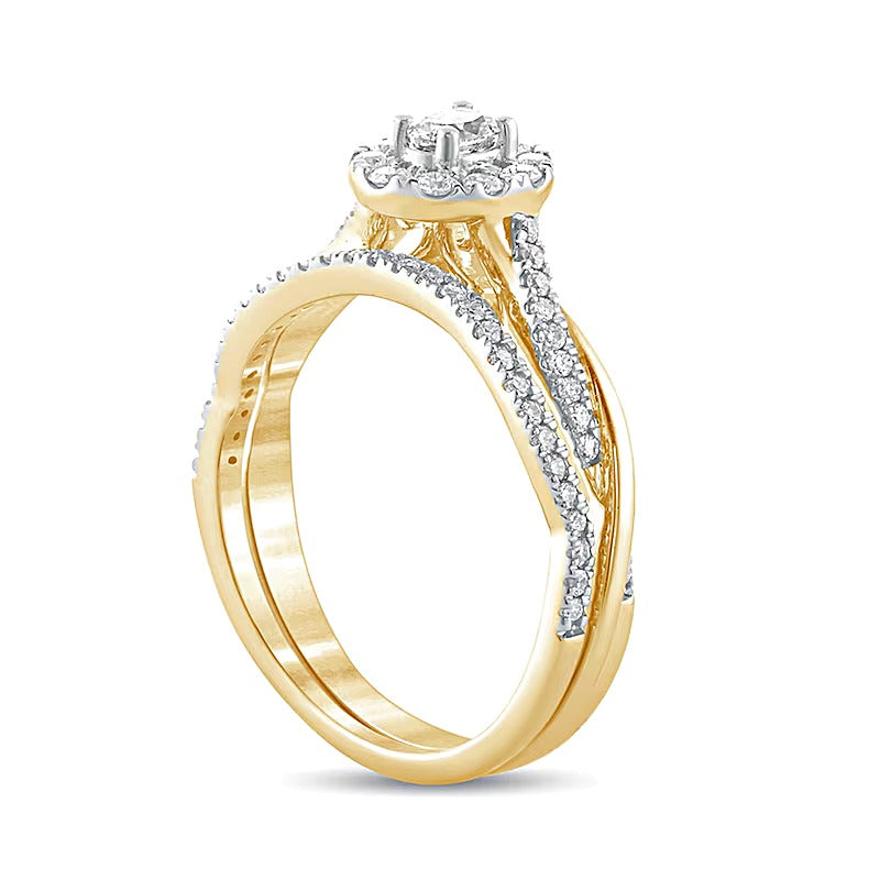 0.5 CT. TW Oval Diamond Frame Twist Shank Bridal Set in 10K Gold