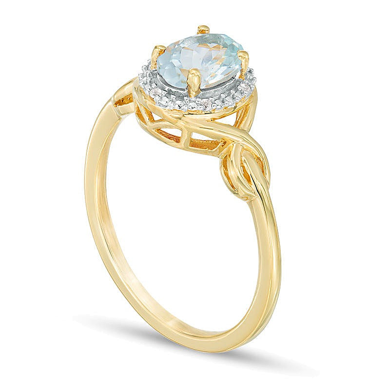 Oval Aquamarine and Diamond Accent Twist Ring in 10K Gold