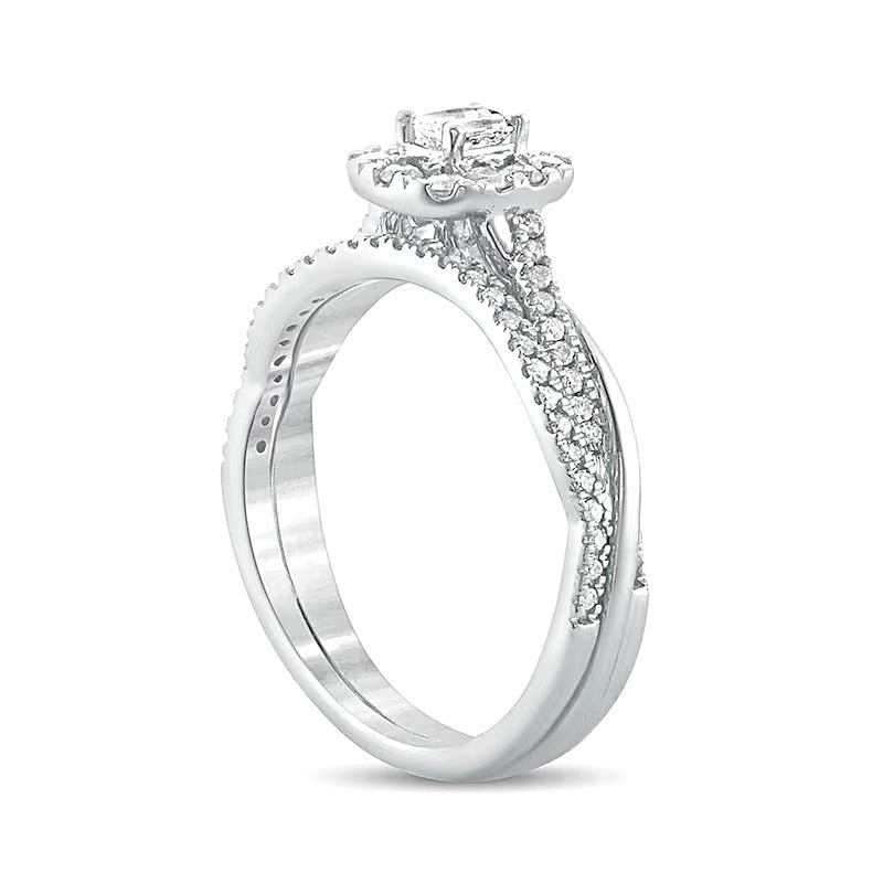 0.5 CT. TW Emerald-Cut Diamond Frame Twist Shank Bridal Set in 10K White Gold