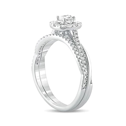 0.5 CT. TW Emerald-Cut Diamond Frame Twist Shank Bridal Set in 10K White Gold