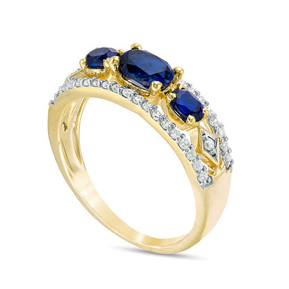 Sideways Oval Lab-Created Blue Sapphire and 0.25 CT. TW Diamond Three Stone Ring in 10K Gold
