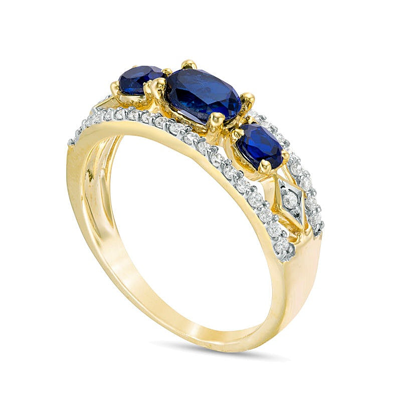 Sideways Oval Lab-Created Blue Sapphire and 0.25 CT. TW Diamond Three Stone Ring in 10K Gold