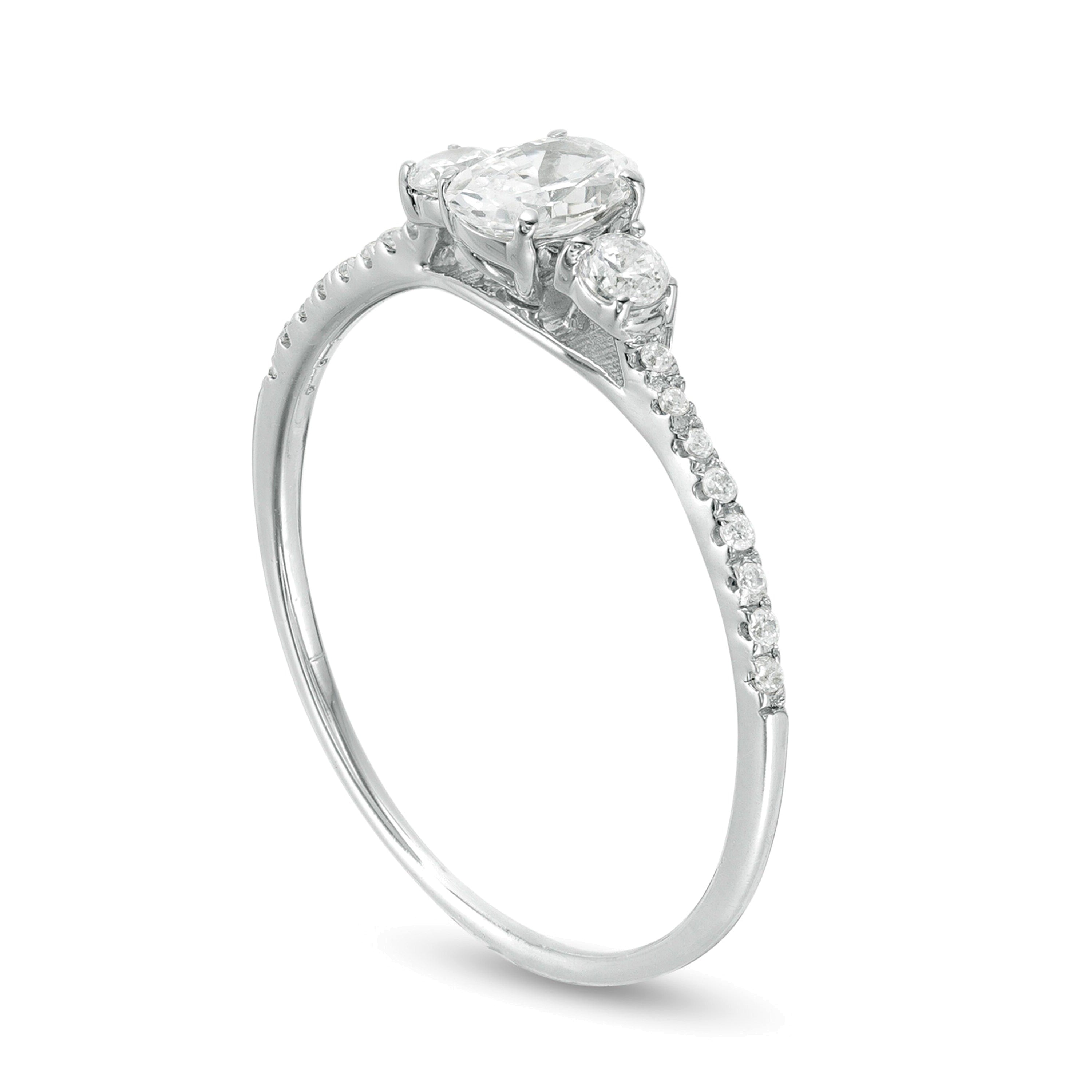 0.63 CT. TW Oval and Round Diamond Three Stone Engagement Ring in 14K White Gold