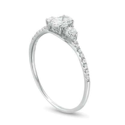 0.63 CT. TW Oval and Round Diamond Three Stone Engagement Ring in 14K White Gold
