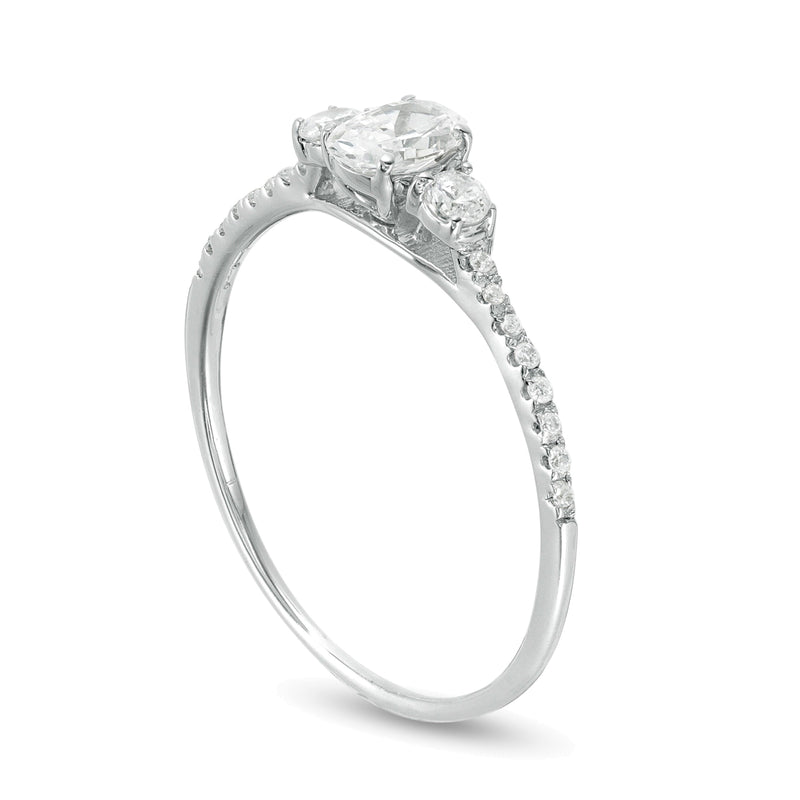 0.63 CT. TW Oval and Round Diamond Three Stone Engagement Ring in 14K White Gold