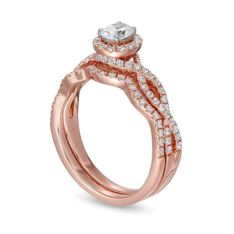 1.0 CT. TW Oval Diamond Frame Split Shank Bridal Set in 14K Rose Gold (I/I2)