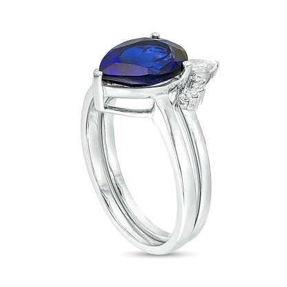 Pear-Shaped Lab-Created Blue Sapphire, White Topaz and 0.05 CT. TW Diamond Crown Bridal Set in 10K White Gold