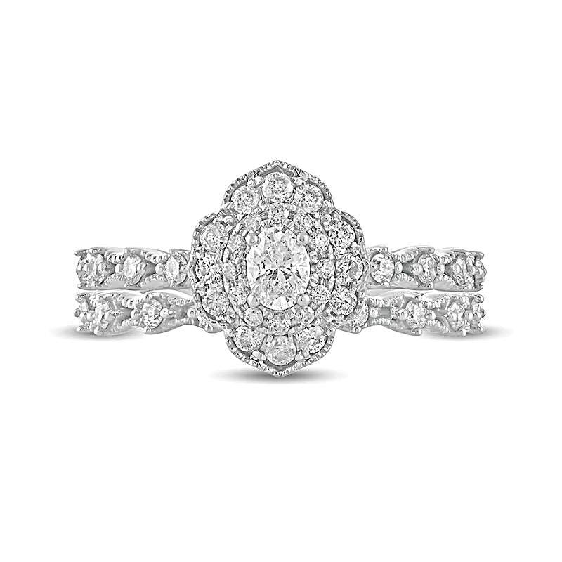 0.63 CT. TW Oval Diamond Frame Vintage-Style Bridal Set in 10K White Gold