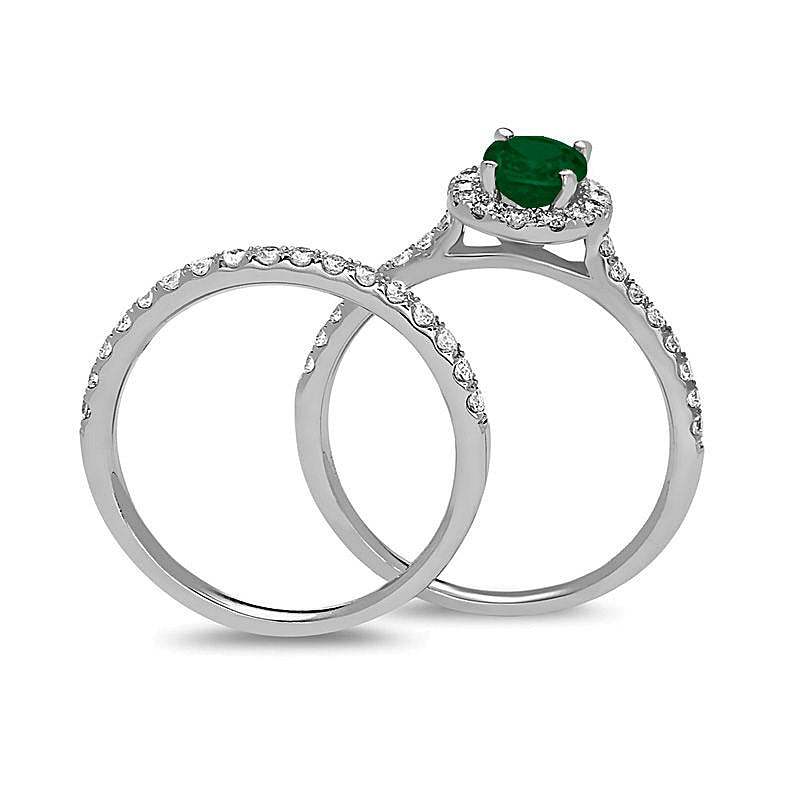 Oval Emerald and 0.63 CT. TW Diamond Frame Bridal Set in 14K White Gold