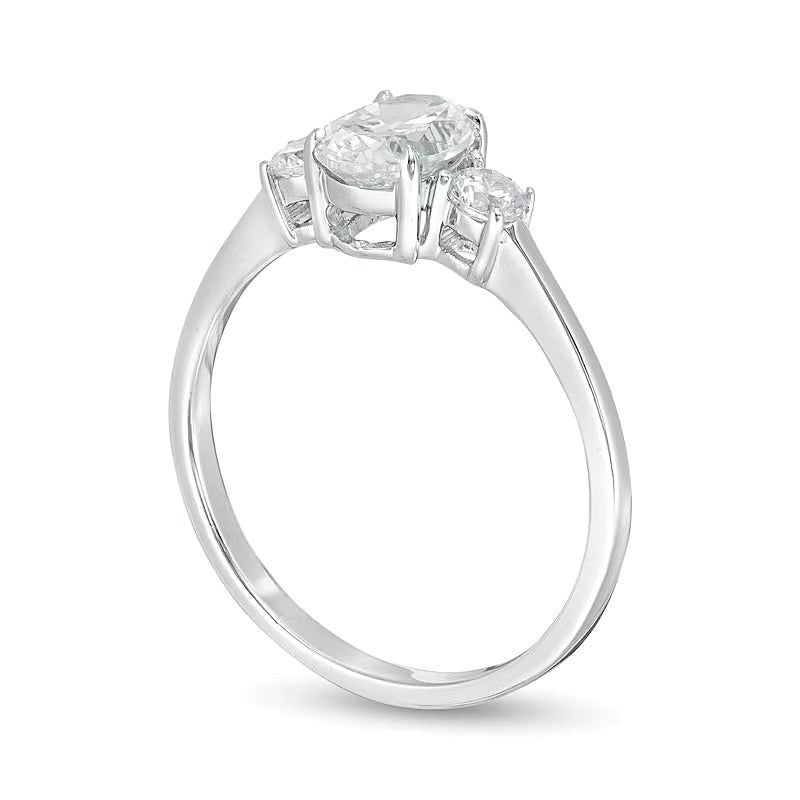 1.0 CT. TW Oval and Round Diamond Three Stone Engagement Ring in 14K White Gold