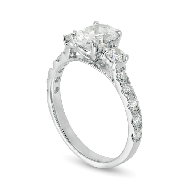 1.75 CT. TW Oval and Round Diamond Three Stone Engagement Ring in 14K White Gold