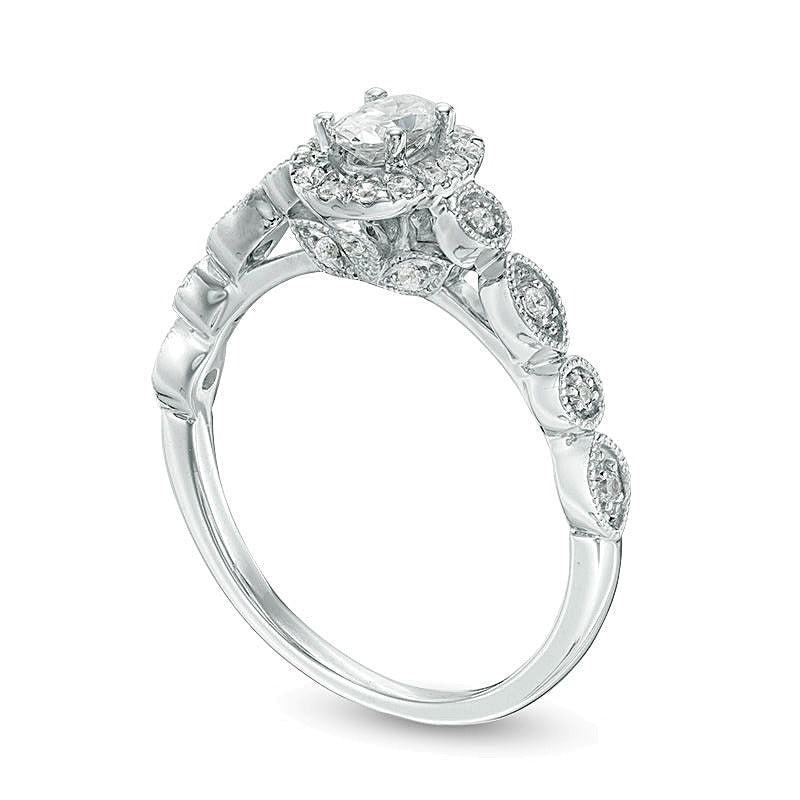 0.5 CT. TW Oval Diamond Frame Bridal Set in 14K Gold