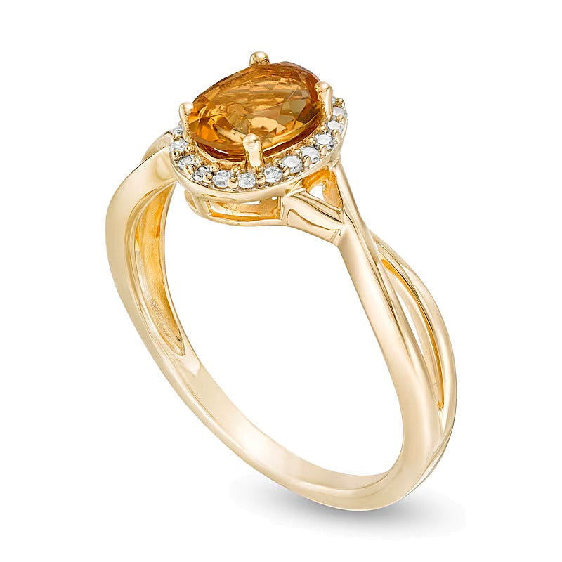 Oval Citrine and 0.07 CT. TW Diamond Frame Twist Shank Ring in 10K Gold