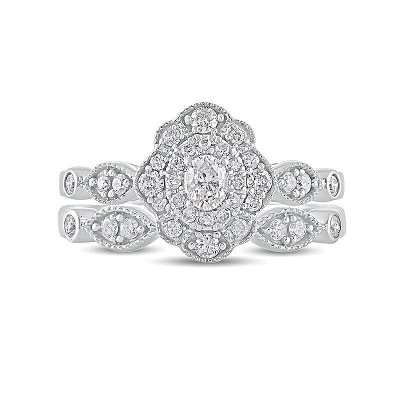 0.63 CT. TW Oval Diamond Double Petal Frame Vintage-Style Bridal Set in 10K White Gold