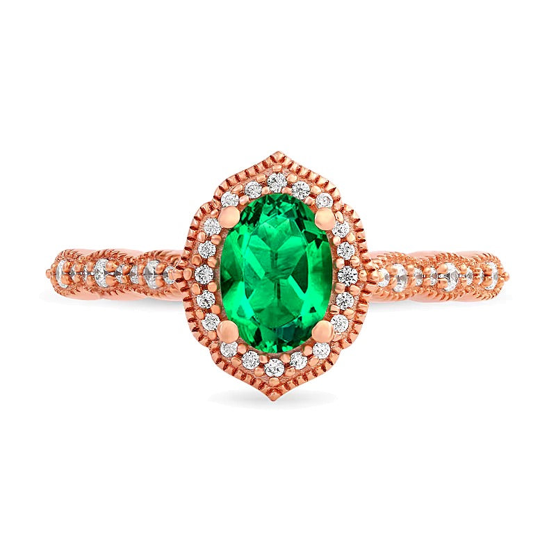 Oval Emerald and 0.17 CT. TW Diamond Quatrefoil Frame Vintage-Style Ring in 10K Rose Gold