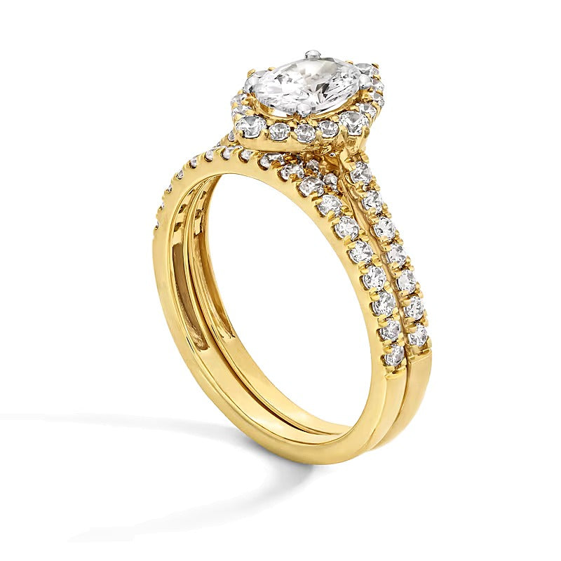 1.5 CT. TW Oval Diamond Frame Bridal Set in 14K Gold