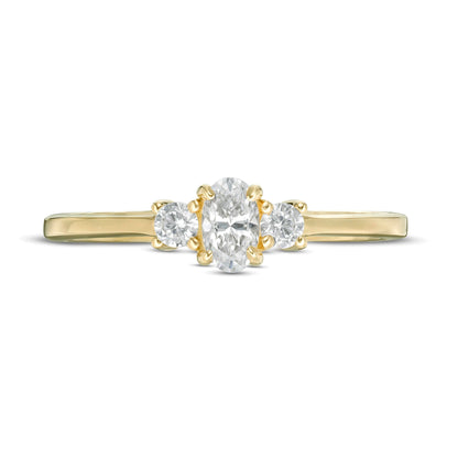 0.5 CT. TW Oval and Round Diamond Three Stone Engagement Ring in 14K Gold