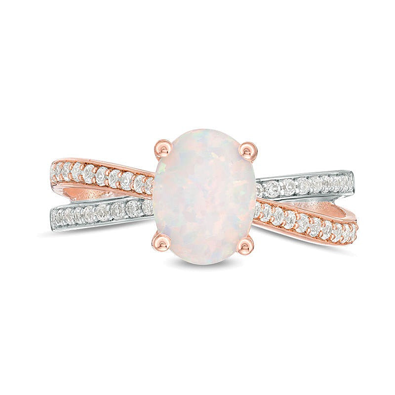 Oval Opal and 0.25 CT. TW Diamond Crossover Ring in Sterling Silver and Rose Rhodium