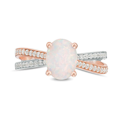 Oval Opal and 0.25 CT. TW Diamond Crossover Ring in Sterling Silver and Rose Rhodium