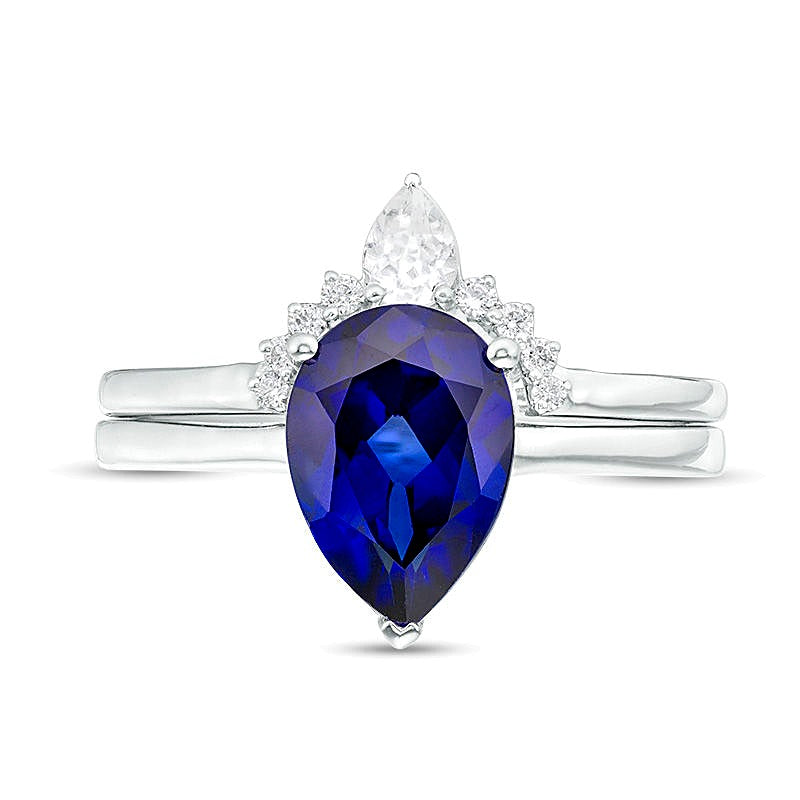 Pear-Shaped Lab-Created Blue Sapphire, White Topaz and 0.05 CT. TW Diamond Crown Bridal Set in 10K White Gold