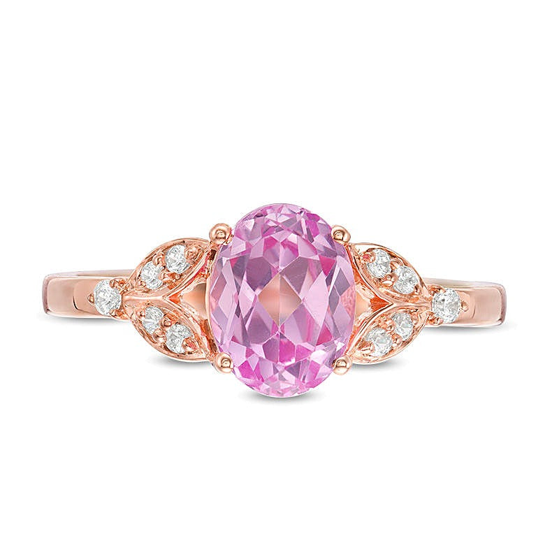 Oval Lab-Created Pink Sapphire and 0.1 CT. TW Diamond Leaf Sides Ring in 10K Rose Gold