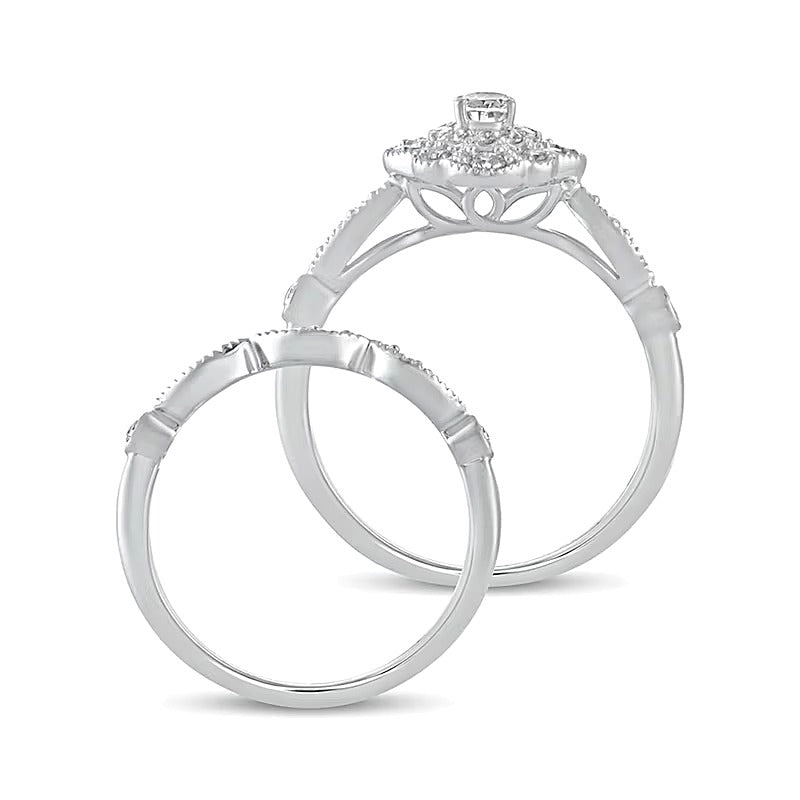0.63 CT. TW Oval Diamond Double Petal Frame Vintage-Style Bridal Set in 10K White Gold