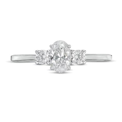 0.63 CT. TW Oval and Round Diamond Three Stone Engagement Ring in 14K White Gold