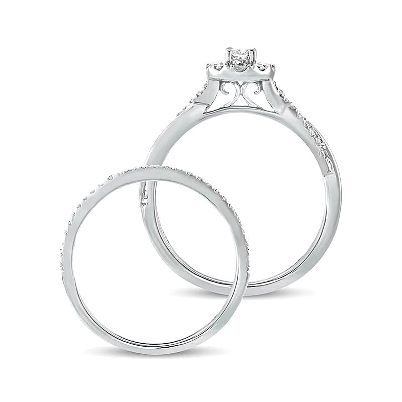 0.5 CT. TW Oval Diamond Frame Twist Shank Bridal Set in 10K White Gold