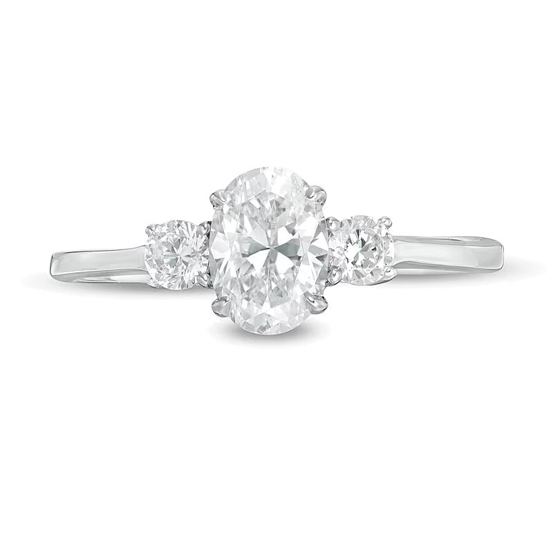 1.0 CT. TW Oval and Round Diamond Three Stone Engagement Ring in 14K White Gold