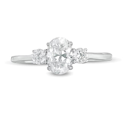 1.0 CT. TW Oval and Round Diamond Three Stone Engagement Ring in 14K White Gold