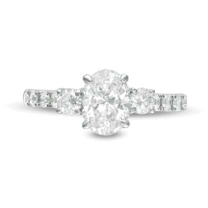 1.75 CT. TW Oval and Round Diamond Three Stone Engagement Ring in 14K White Gold
