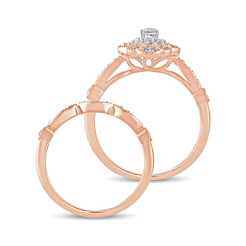 0.63 CT. TW Oval Diamond Double Petal Frame Vintage-Style Bridal Set in 10K Rose Gold