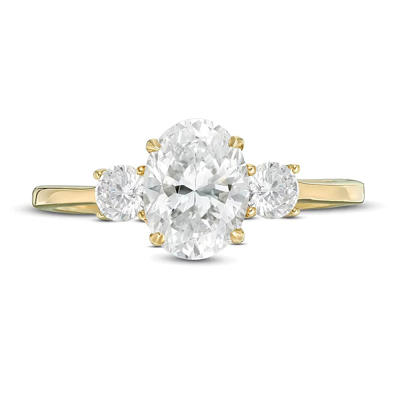 1.25 CT. TW Oval and Round Diamond Three Stone Engagement Ring in 14K Gold
