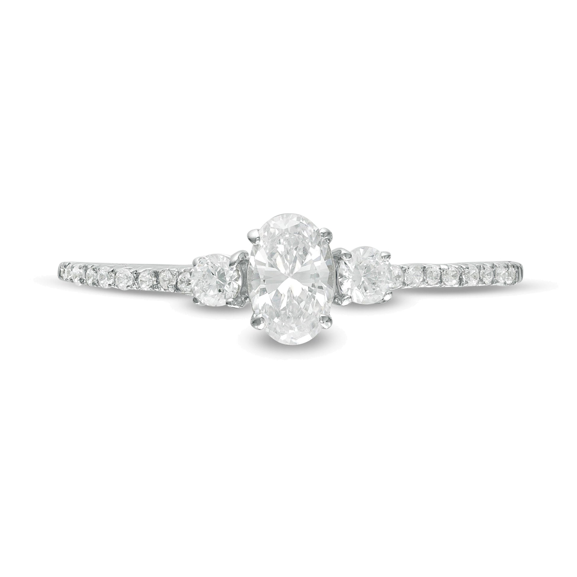 0.63 CT. TW Oval and Round Diamond Three Stone Engagement Ring in 14K White Gold