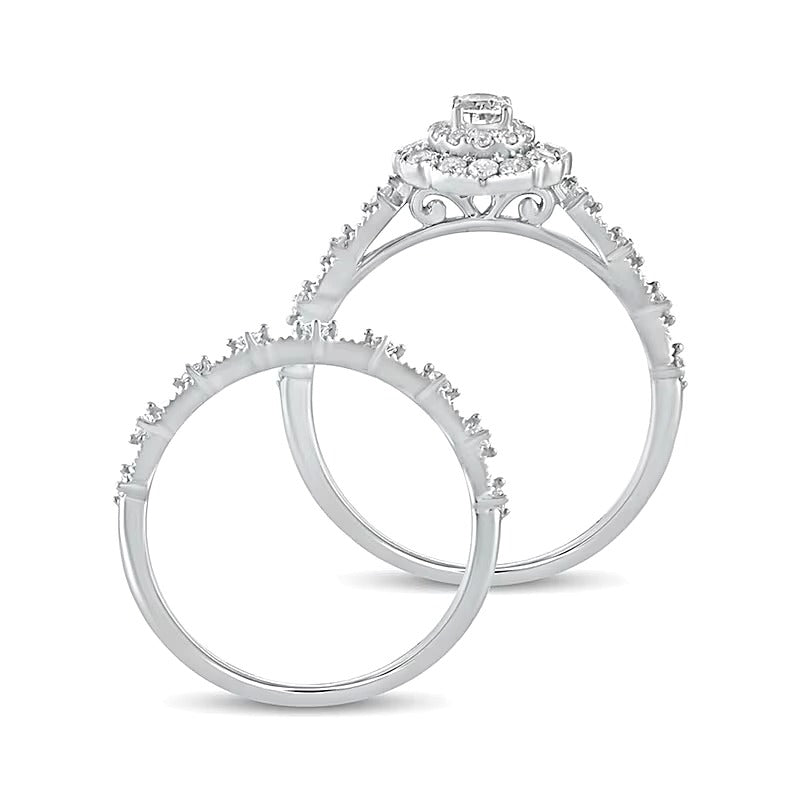 0.63 CT. TW Oval Diamond Frame Vintage-Style Bridal Set in 10K White Gold
